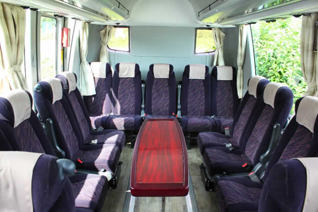 A large bus Interior image a saloon layout）